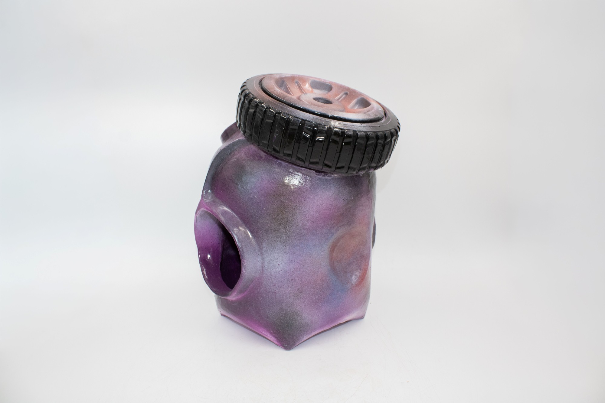 This ceramic vessel uses openings to reflect an unstable idea of home, allowing viewers to see both the void inside and an invitation to enter.