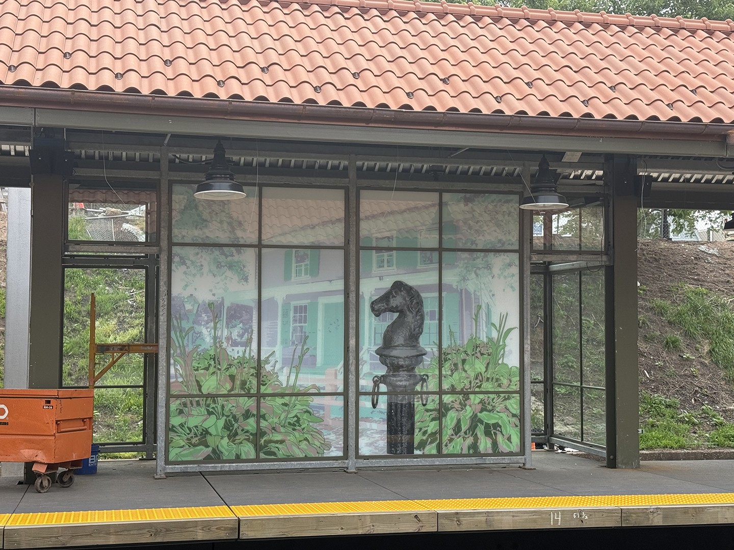 one of four platform windscreens designed for the Perth Amboy Station