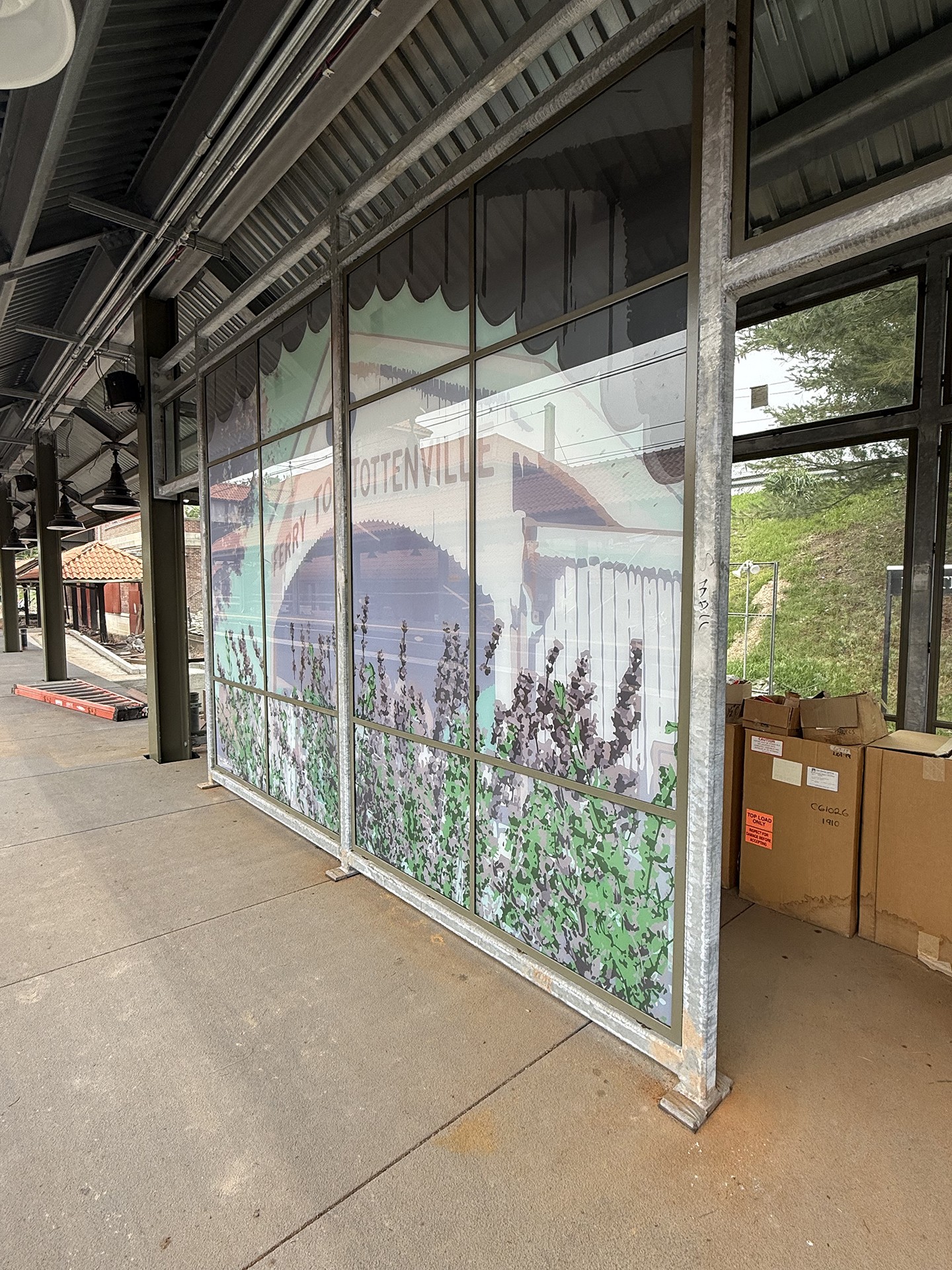 one of four platform windscreens designed for the Perth Amboy Station
