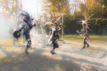 Dancers participate in an Aztec dance during a Day of the Dead event at Delaware Art Museum