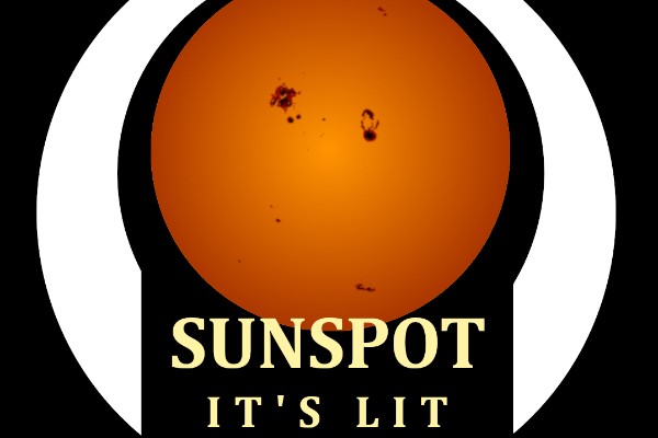 A warm perfect circle of the sun with dark spots on it surrounded by a white band and the words “Sunspot It’s Lit” on the bottom between the ends of the band, all on a field of black.
