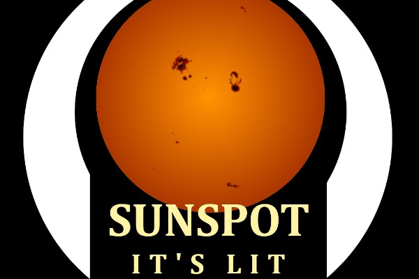 A warm perfect circle of the sun with dark spots on it surrounded by a white band and the words “Sunspot It’s Lit” on the bottom between the ends of the band, all on a field of black.