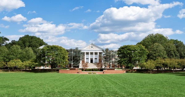A photograph of the green in front of a building at University of Maryland.