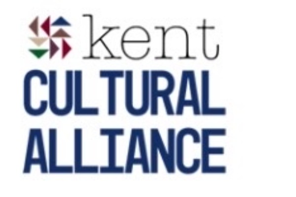 Logo of the Kent Cultural Alliance -- an artistic image of a flying geese quilt pattern in multiple colors and the words Kent Cultural Alliance.