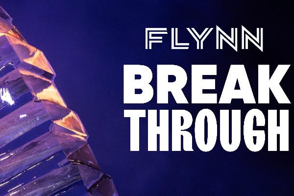 "Flynn Break Through" in white lettering is displayed on a dark blue background with purple/orange structure to the left of the letters.