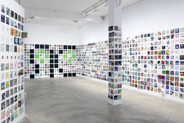 Picture inside RoCo an art gallery with thousands of pieces of small art 6 inches in size.