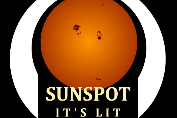 A warm perfect circle of the sun with dark spots on it surrounded by a white band and the words “Sunspot It’s Lit” on the bottom between the ends of the band, all on a field of black.
