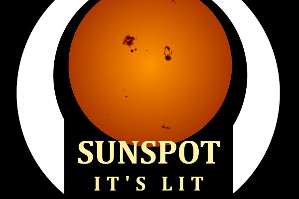 A warm perfect circle of the sun with dark spots on it surrounded by a white band and the words “Sunspot It’s Lit” on the bottom between the ends of the band, all on a field of black.